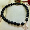 PN 0025 - Foto1 Pulsera Onix 6 mm con Plata y Nudo de Bruja